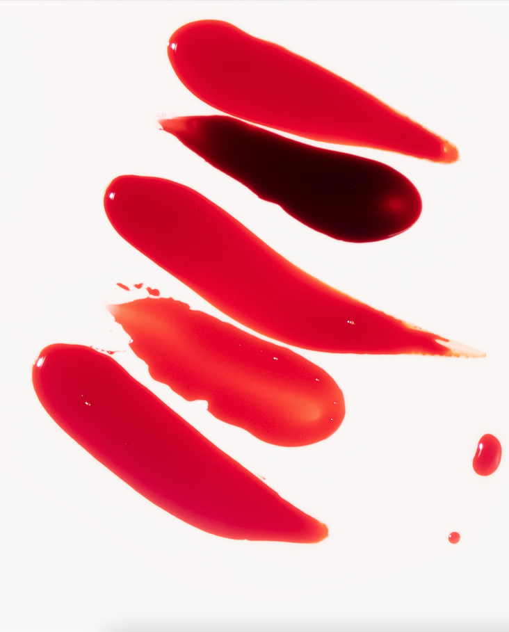 Menstrual blood swatches in varying textures and flow patterns on white background