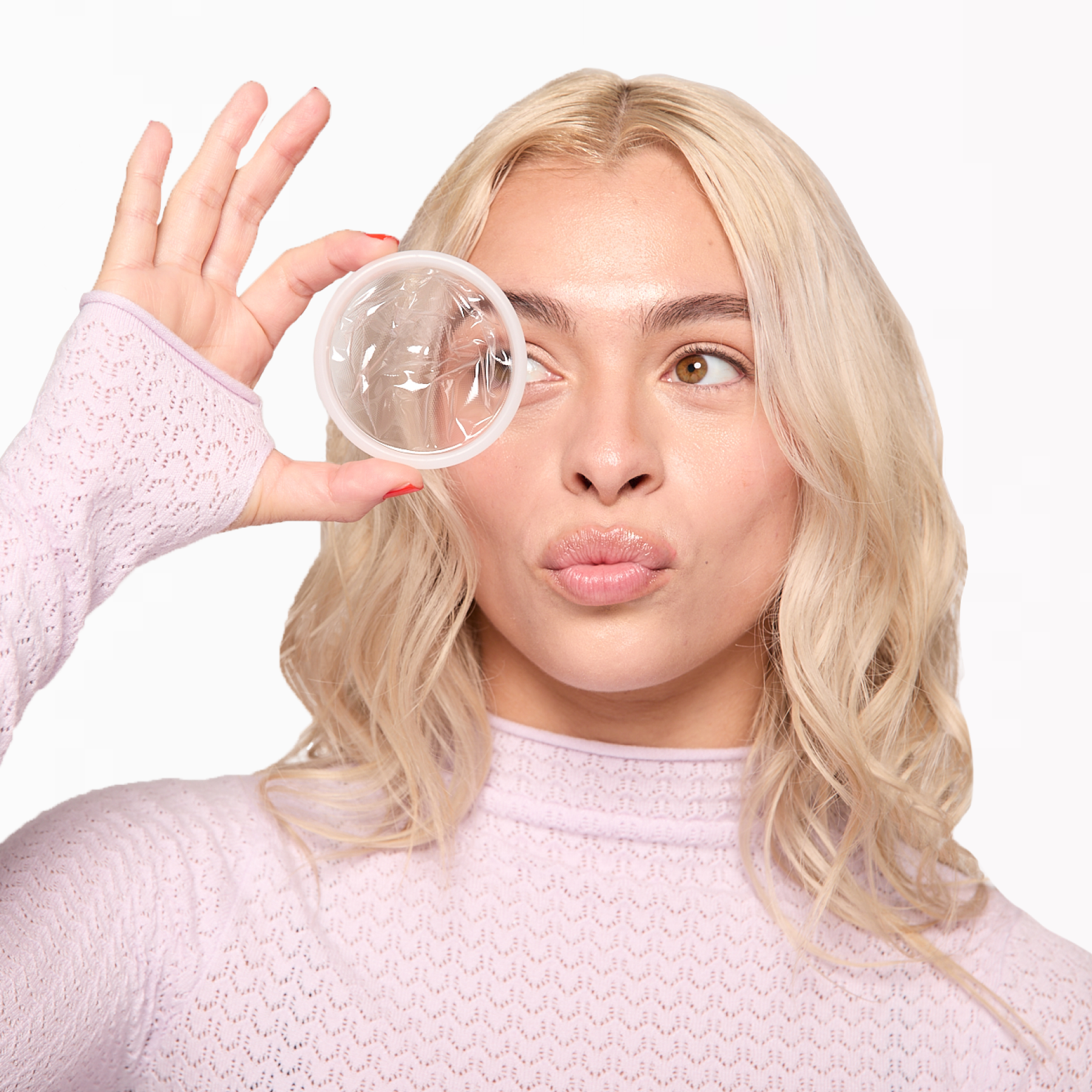 person-holding-plant-based-menstrual-disc.png